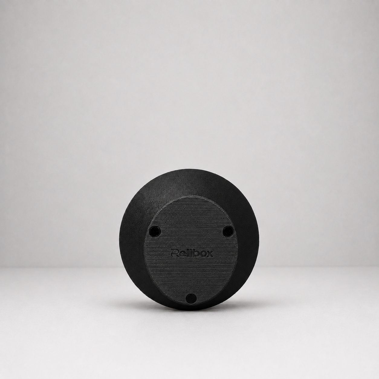 Bottom view of Rollbox Serve Blackout showing the weighted base, grip feet and Rollbox logo