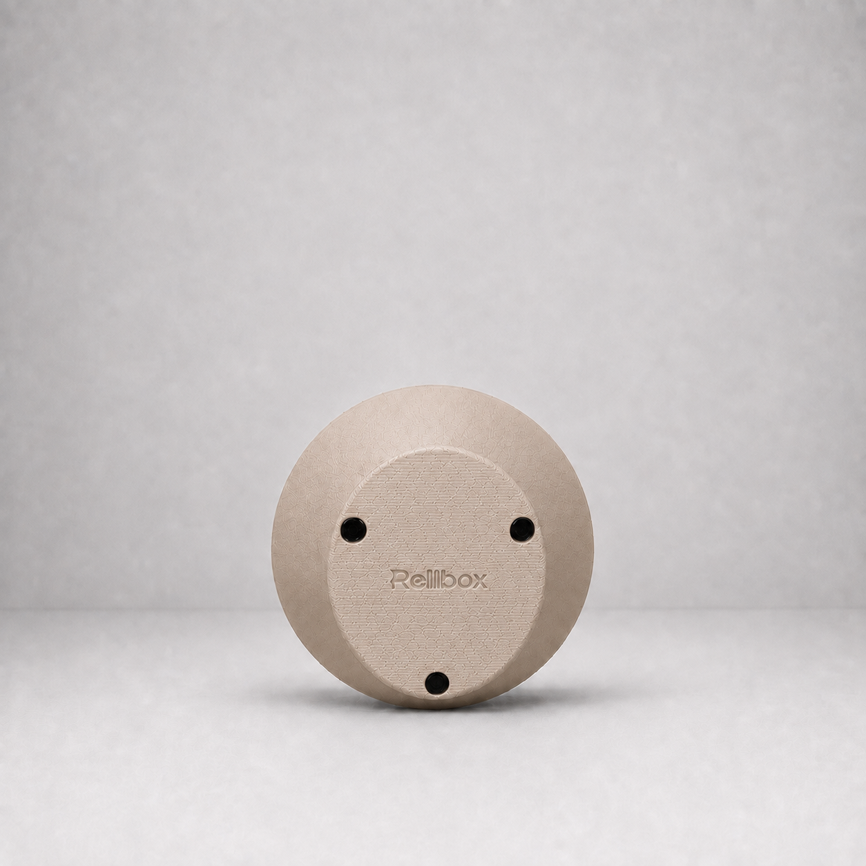 Bottom view of Rollbox Serve Dune showing the weighted base, grip feet and Rollbox logo