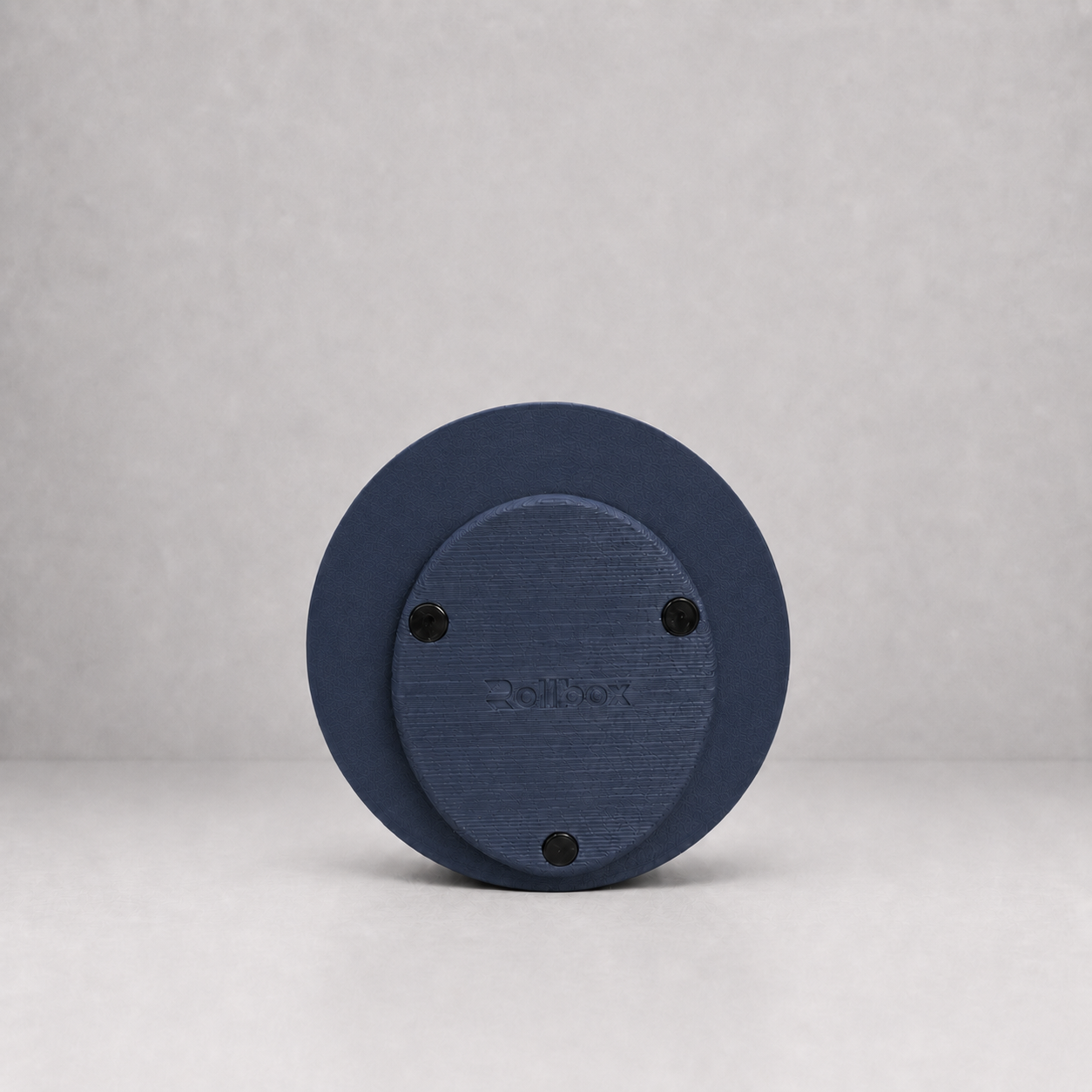 Bottom view of Rollbox Studio Midnight showing the weighted base, grip feet and Rollbox logo