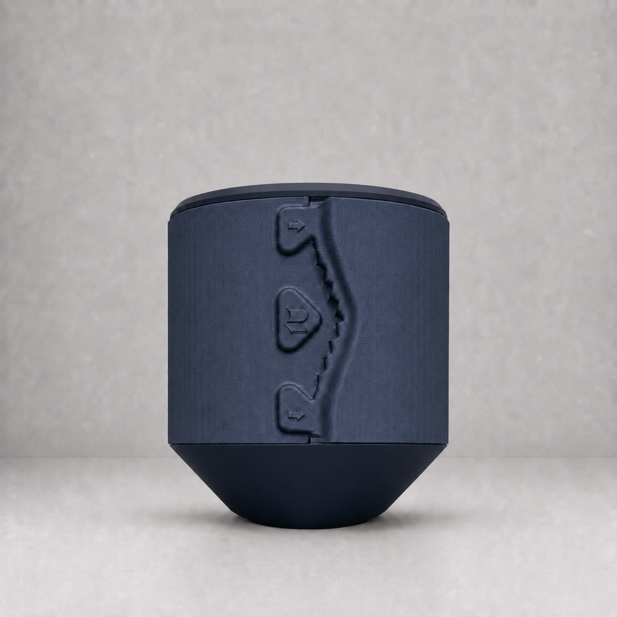 Rollbox Studio Midnight tissue dispenser showing the integrated cutting edge and front logo
