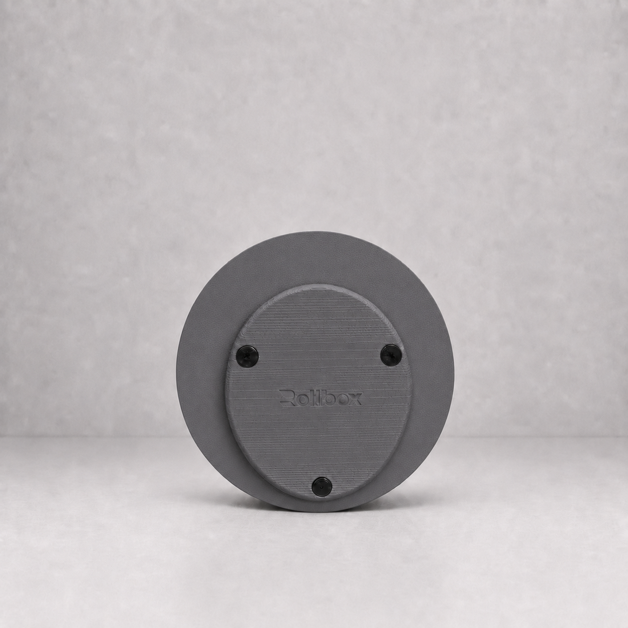 Bottom view of Rollbox Studio Stone showing the weighted base, grip feet and Rollbox logo